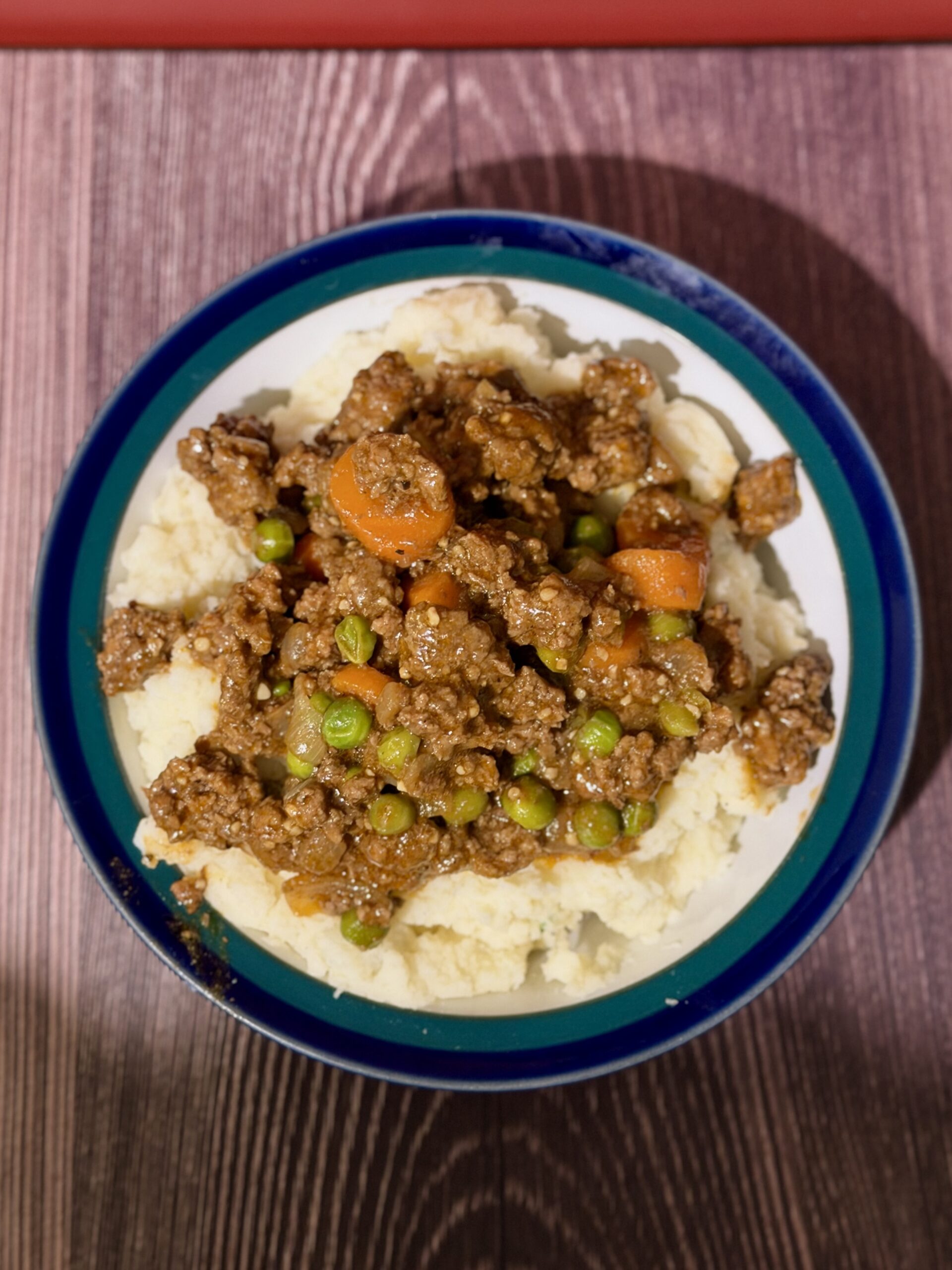 upside-down cottage pie with beef gravy served over mashed potatoes